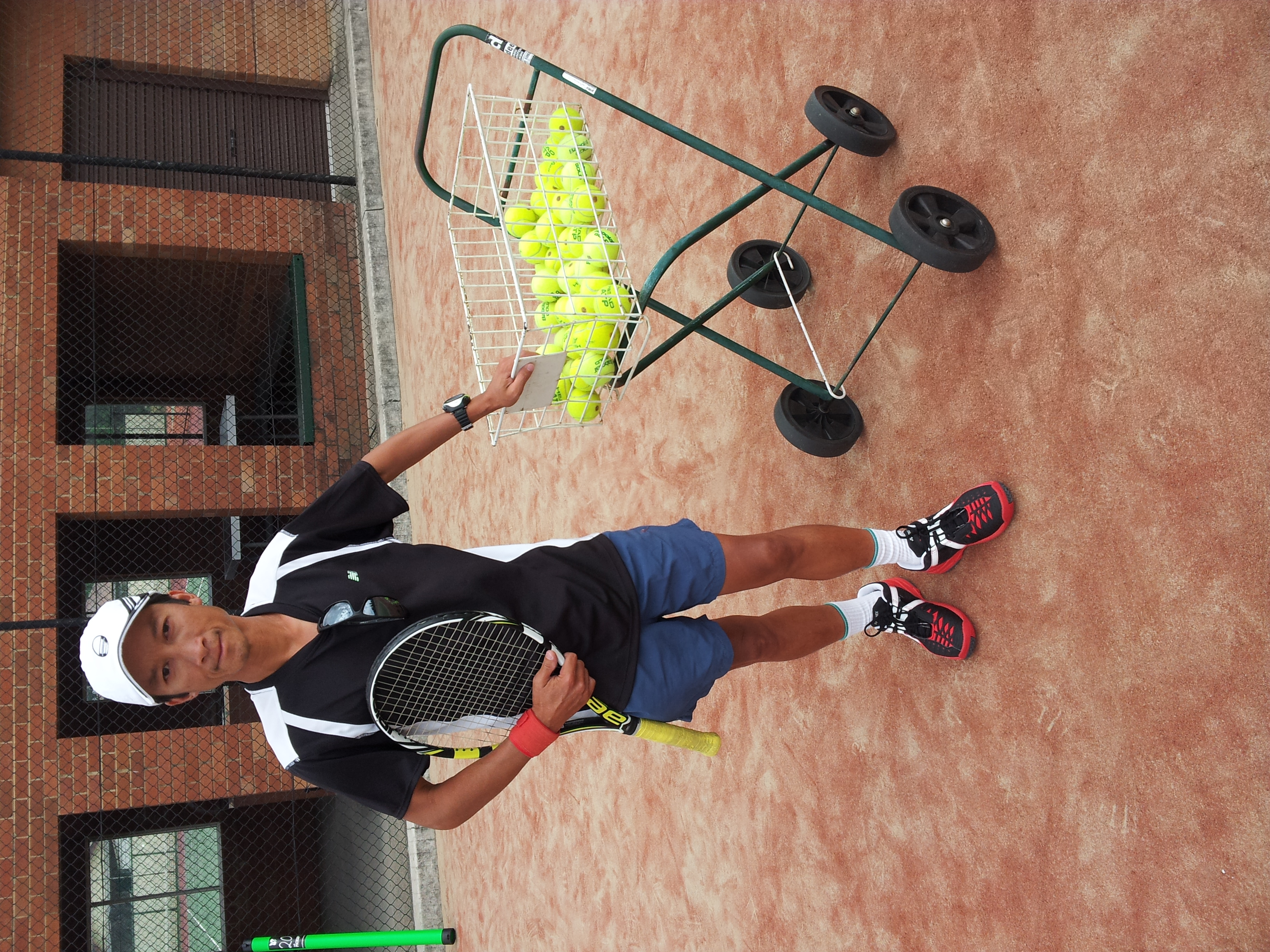 John Morris running squad training at Auburn Tennis Centre